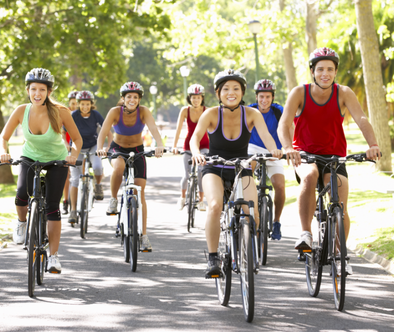 Happy Cyclists With Safer Bike Bells on Suburban Street